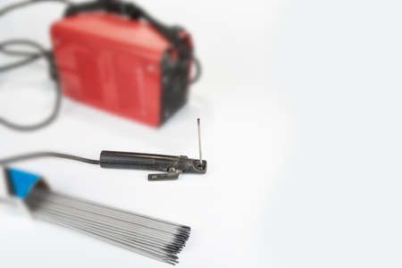 Welding inventer and electrodes on a whiteの写真素材