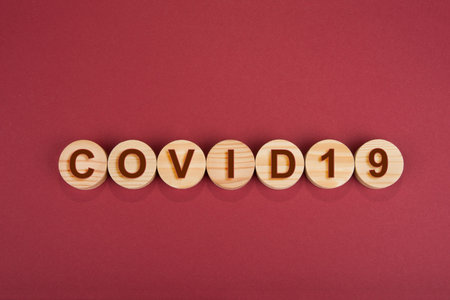 Covid-19 sign on a wooden circles sign