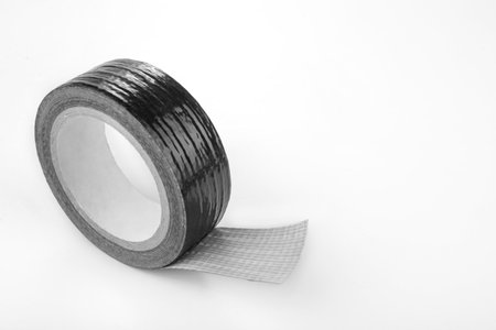 Roll of the Black duct tape for repair on a whiteの写真素材