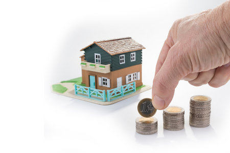 Saving money for a new house. Stack of coinsの写真素材