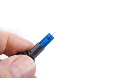 Blood sugar level monitoring with glucose meter. Needle closeupの写真素材