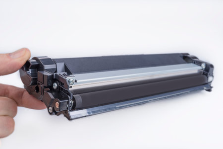Old replaced printer cartridge on a white background