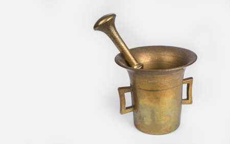 Golden Mortar and pestle set on a white backgroundの写真素材