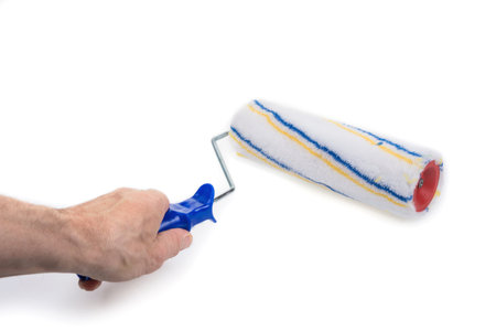 New paint roller with handle on a whiteの写真素材
