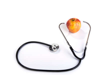 Stethoscope on the apple. Healthy food and lifestyle conceptの写真素材