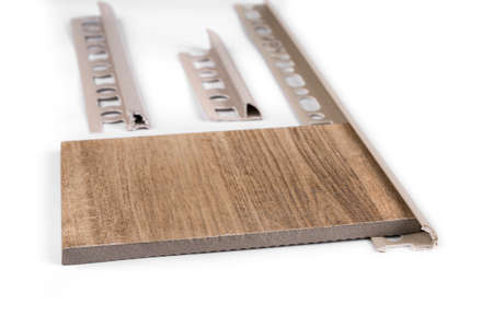 Round edge plastic ceramic tile trim  on a white backgroundの写真素材
