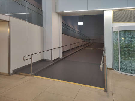 Wheelchair ramp for a disabled persons at the airport and stationの写真素材
