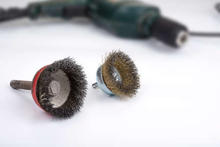 Metal wire brush for a drill machine on a whiteの写真素材