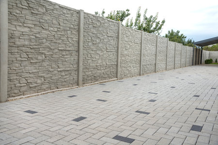 Concrete pattern fence and block paving tilesの写真素材