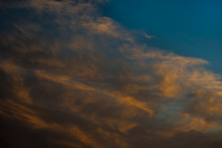 Dramatic clouds at the sunsetの写真素材