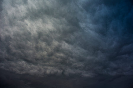 Stormy rain clouds background. Dark sky