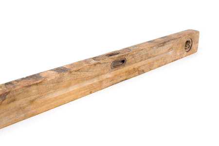 Old vintage construction wood level on a white background
