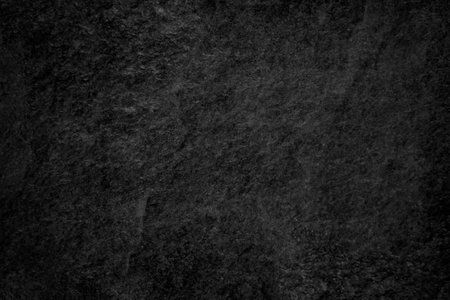 Dark gray black slate texture in natural pattern. Black stone wallの写真素材
