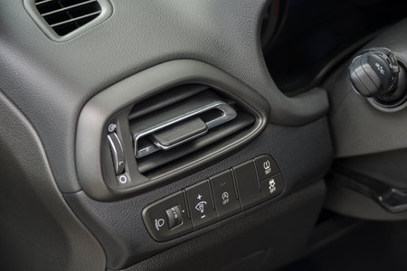 Air vent grill in a car. Air conditioner grid and control panel buttons.の写真素材