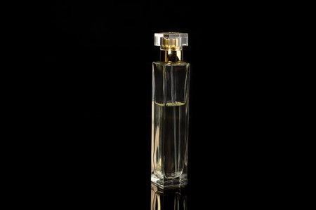 Half full woman perfume on a black backgroundの写真素材
