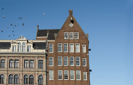 Traditional Dutch Baroque and Gothic old architecture in Amsterdam from 17th century.の写真素材