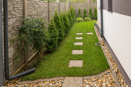 Gutter Downspout Placement into the garden. Rain water use in your house