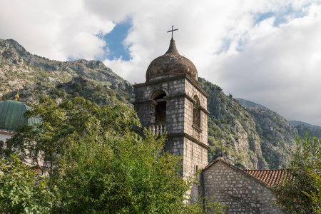 Church of St. Nikola in Kotor. Fortress with mountains in the backgroundの写真素材