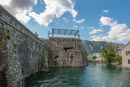Walls of the Kotor Fortress with mountains and blue sky, Montenegroの写真素材