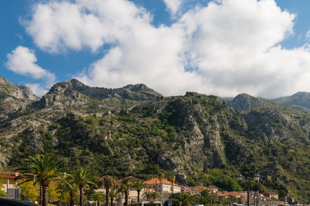 Walls of the Kotor Fortress with mountains and blue sky, Montenegroの写真素材