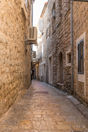 Budva Stone street in the old medieval town of mediterranean countryの写真素材
