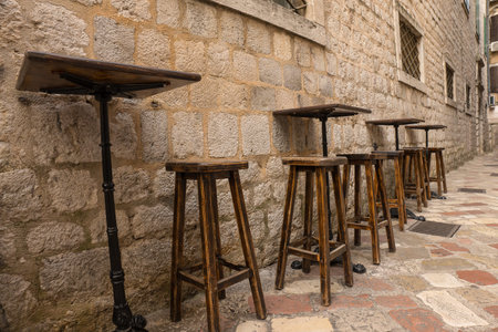 Empty chairs and tables on the medieval street