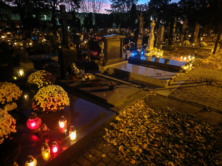 Traditional candles at a cemetery on All Saints' Day in Europeの写真素材