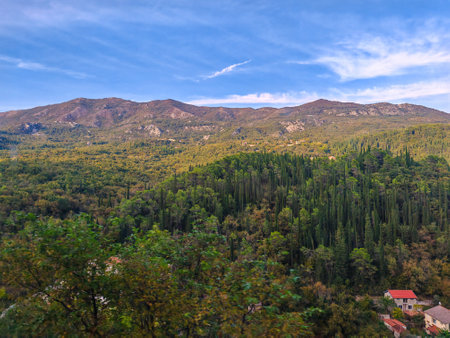 A picturesque mountain landscape with scattered housesの写真素材
