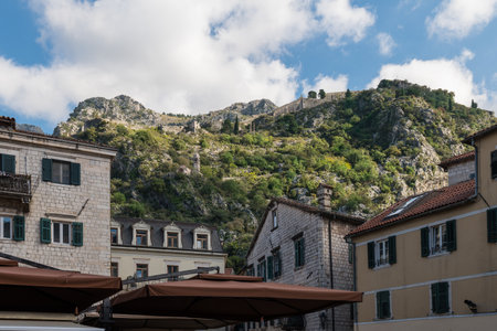 Walls of the Kotor Fortress with mountains and blue skyの写真素材