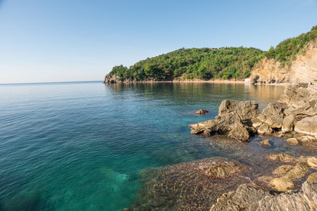 Turquoise water of Budva mogren beachの写真素材
