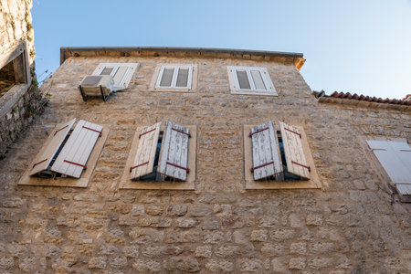 Medieval stone house with closed shuttersの写真素材