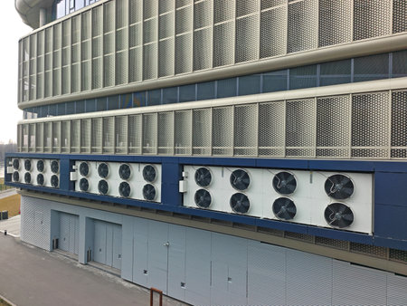 Air conditioners on the side of the buildingの写真素材