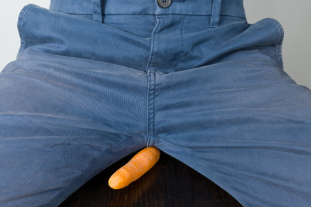 Eggs and carrot as a symbol of man's balls and penis.の写真素材