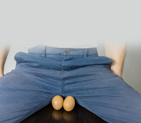 Eggs and carrot as a symbol of man's balls and penis.の写真素材