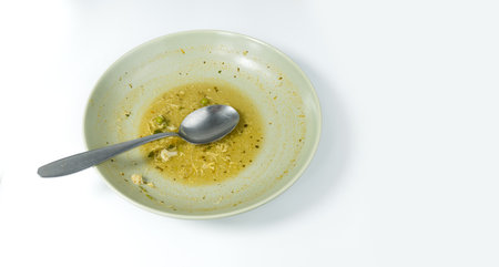 Dirty food waste in a plate on white backgroundの写真素材