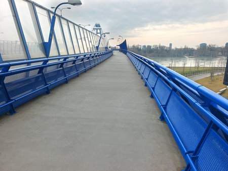 Sidewalk on the bridge over the riverの写真素材