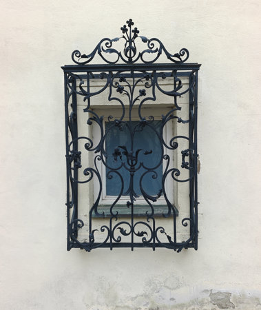 Black Windows decorative grilles on old houseの写真素材