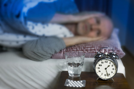 Sleepless unhappy senior man in the bedの写真素材