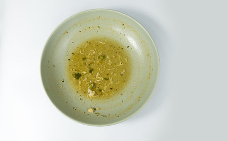 Food waste in a plate on white backgroundの写真素材
