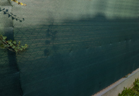 Fabric Shade cloth on a fence for a privacyの写真素材