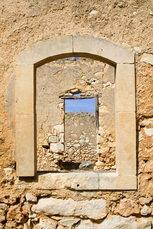 An old window in an ancient farm house.の写真素材