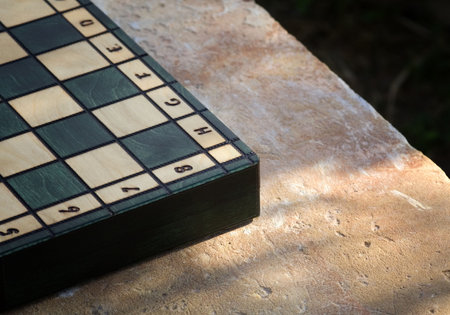 A chessboard on the rock table to the sunsetの写真素材