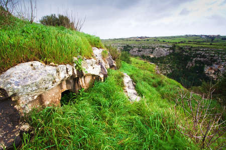 A monumental prehistorich tomb in the sicilian land. It is a very old sepulchre.の写真素材