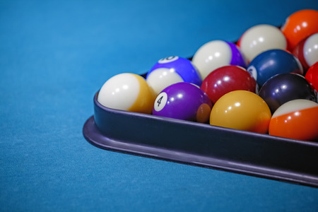 Multi-colored billiard balls stacked triangleの写真素材