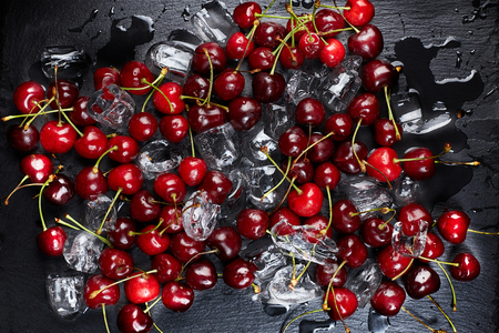 Cherry, cherry with ice cubes on a dark backgroundの写真素材
