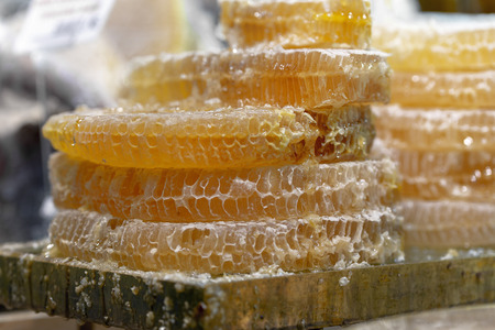 Honey in honeycombs is sold at the marketの写真素材