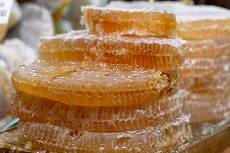 Honey in honeycombs is sold at the marketの写真素材