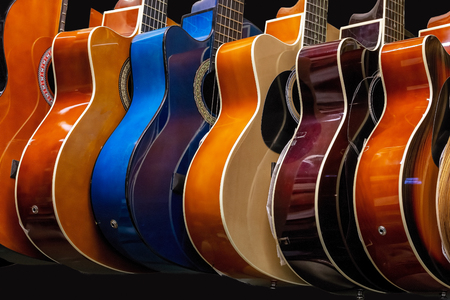 Guitars hanging in a row on the wallの写真素材