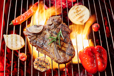 T-Bon steak grilled with vegetables. Fried meat on the fire, barbecueの写真素材