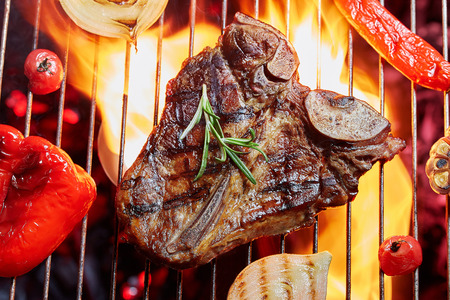 T-Bon steak grilled with vegetables. Fried meat on the fire, barbecueの写真素材